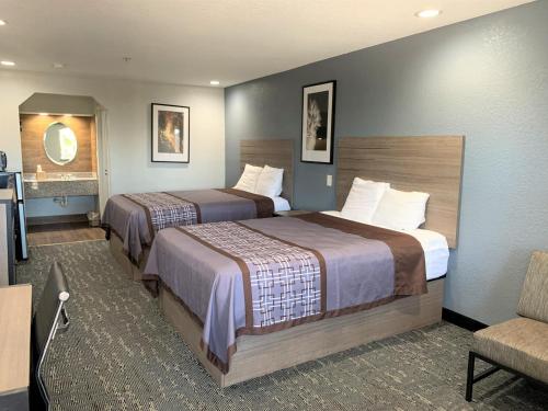 Posteľ alebo postele v izbe v ubytovaní Extended Stay Inn & Suites