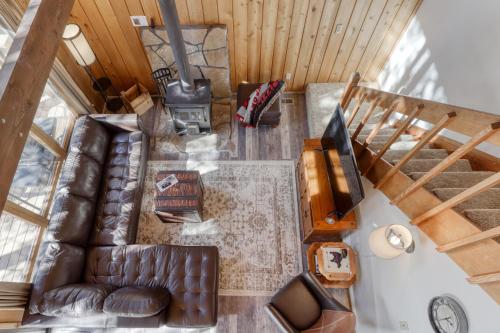 an overhead view of a living room with a leather couch at 3 Lofty Lane in Sunriver