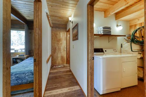 a kitchen with a washer and dryer in a room at 3 Lofty Lane in Sunriver