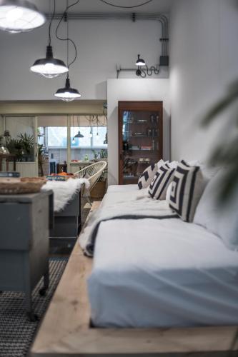 a room with two beds with pillows and a table at 3Bedrooms City Nimman in Chiang Mai