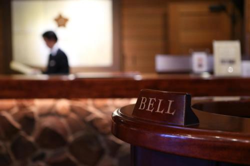 a man is sitting at a counter in a room at Tateshina Tokyu Hotel in Chino