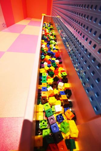a long line of lego cars on a shelf at Diudiu Dang Paternity B&B in Dongshan