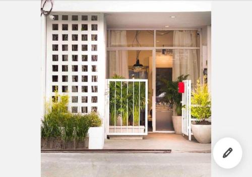 an open front door of a house with plants at 3Bedrooms City Nimman in Chiang Mai