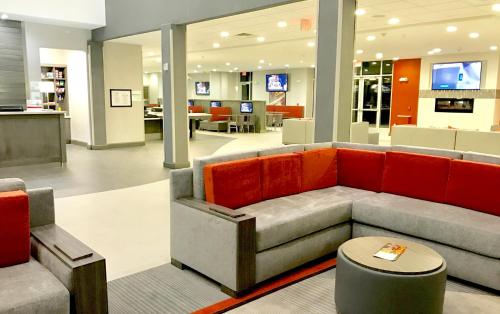 a lobby with a couch and chairs in a store at Holiday Inn Abilene - North College Area by IHG in Abilene