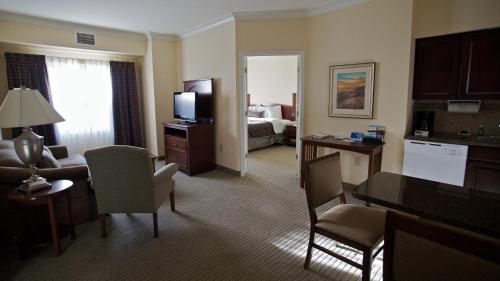 a large hotel room with a living room at Staybridge Suites San Antonio Sea World by IHG in San Antonio