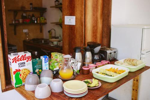 a table with breakfast foods and drinks on it at Siri Beach Lodge in Nungwi