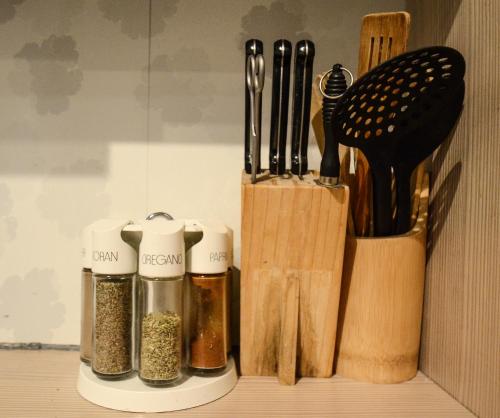 a wooden table topped with lots of kitchen utensils at 2 · High-Quality in the heart of Stuttgart 2 in Stuttgart