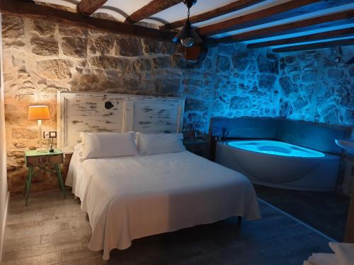 Postel nebo postele na pokoji v ubytování El Racó de Valderrobres