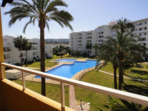 a view from the balcony of a hotel with a swimming pool at Apartamento Familiar in Balcon del Mar