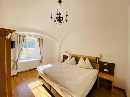 Säng eller sängar i ett rum på Schloss Krottenhof