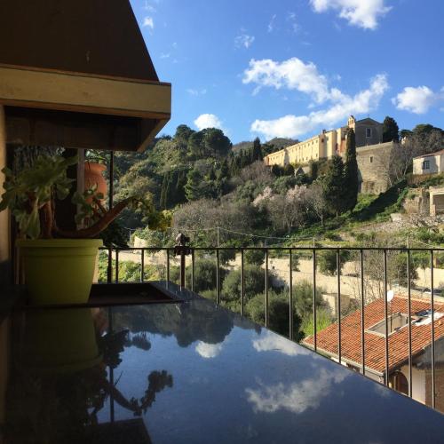 a view of a castle from the balcony of a house at B&B Il Padrino in Savoca 