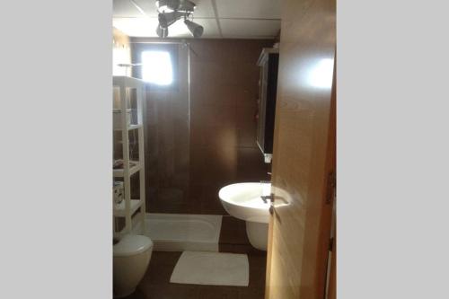a bathroom with a toilet and a sink at Sierra Nevada Luxury Getaway in Güéjar-Sierra