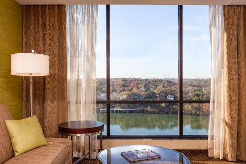 a living room with a large window with a view at Holiday Inn Austin -Town Lake by IHG in Austin