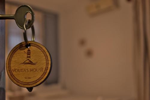 a key chain with a sign that says louis house at Voula's House in Skiathos