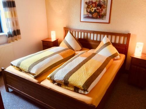 En eller flere senge i et værelse på Haus am Gründel