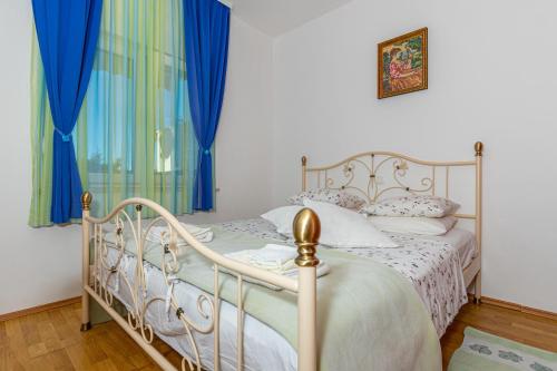 Postel nebo postele na pokoji v ubytování Apartman Dadi