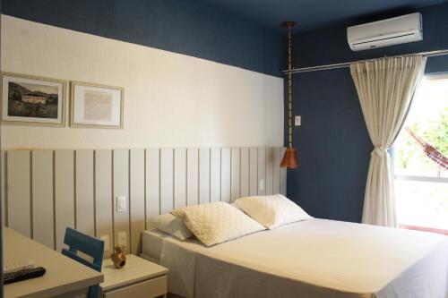 Voodi või voodid majutusasutuse Hotel Icaraí toas