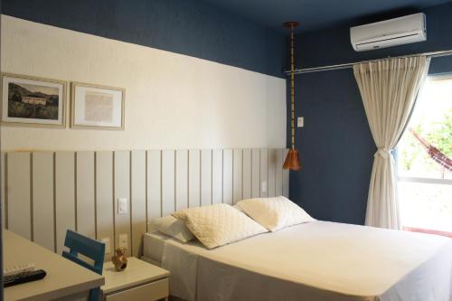 Postel nebo postele na pokoji v ubytování Hotel Icaraí