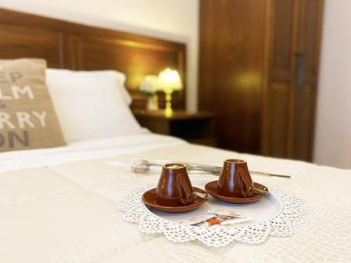 A bed or beds in a room at Relais Cavour