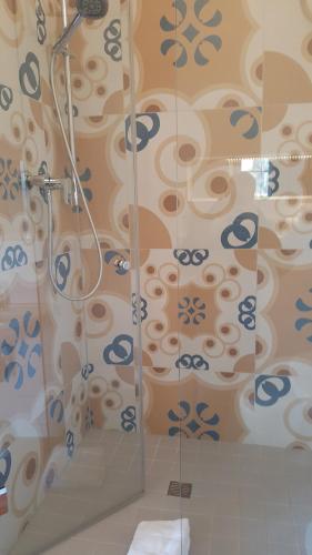 a shower with a glass door in a bathroom at Netts Landhaus in Neustadt an der Weinstraße