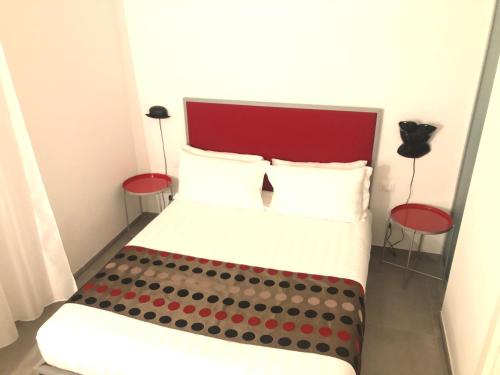 En eller flere senge i et værelse på Room 76