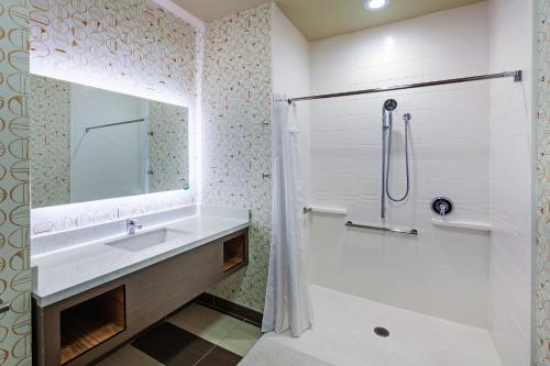 a bathroom with a sink and a shower at Holiday Inn - Amarillo East by IHG in Amarillo