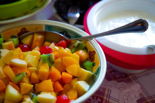 a bowl of fruit and vegetables with a spoon in it at Sant'Andrea Agriturismo con cantina Martignago Vignaioli Asolo Prosecco Docg Wines in Maser