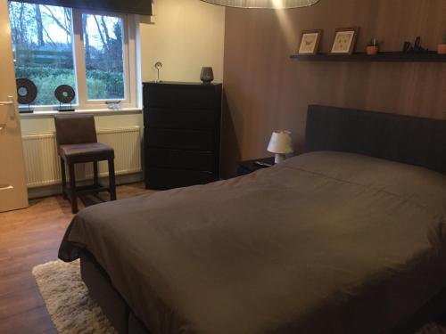 Postel nebo postele na pokoji v ubytování Rumah kita, bungalow met 2 slaapkamers in het mooie Drenthe
