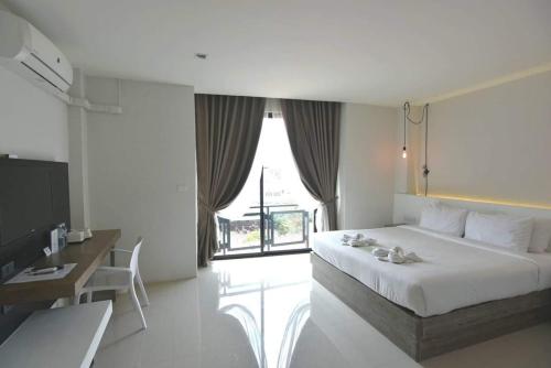 Säng eller sängar i ett rum på Hotel Chuan Chom The High Resort Saraburi - SHA Plus
