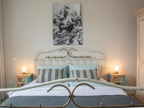 a bedroom with a large bed with two night stands at Seesterne Residenz in Konstanz
