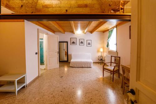 a bedroom with a bed and a table and a chair at B&B Casa Probo in Tricase
