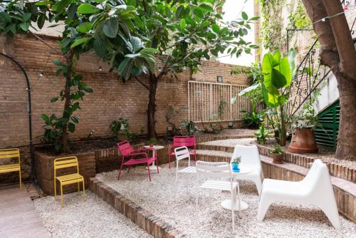 a patio area with a pool, chairs, and tables at ABCyou Bed&Breakfast in Valencia