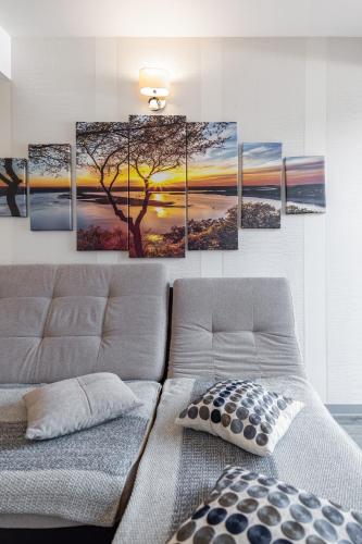a painting of a tree on a wall at B09 Mauritius - Silver Mountain in Poiana Brasov