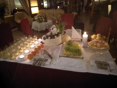 a table with a bunch of food on it at Hotel Polak in Zamość