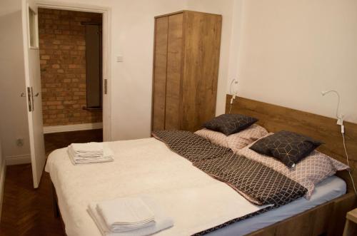 Кровать или кровати в номере Apartament Szymek