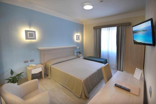 Posteľ alebo postele v izbe v ubytovaní Hotel Belvir