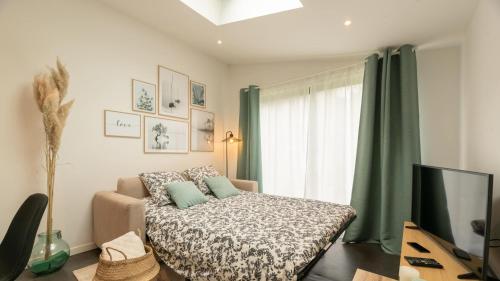 Postel nebo postele na pokoji v ubytování Le Nid Douillet : Superbe Appartement + Jardin privatif