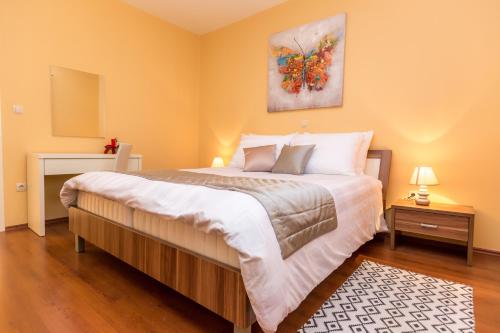 Ένα ή περισσότερα κρεβάτια σε δωμάτιο στο Villa Lara-3D