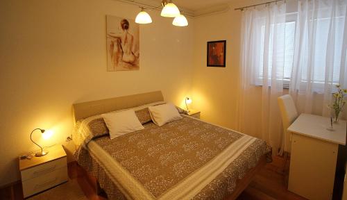 Postel nebo postele na pokoji v ubytování Apartmani Božena Makarska