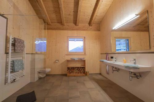 a bathroom with a sink and a toilet at Luxury Naturperle Haus Alpenprinzessin helles Holzhaus zentral , modern & großräumig in Neustift im Stubaital