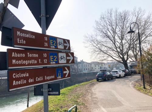 a street sign with many signs on a road at Civico21 in Padova