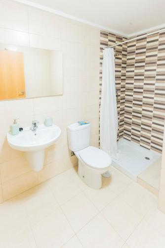 a bathroom with a toilet and a sink and a shower at GLP ALTEA DREAMS in Altea