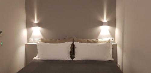 Ένα ή περισσότερα κρεβάτια σε δωμάτιο στο Sarzana's Rooms