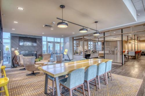 a dining room with a table and chairs in an office at Holiday Inn - Appleton by IHG in Appleton