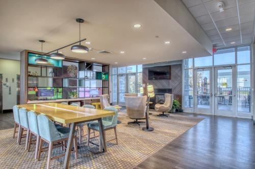 an office with a table and chairs and a desk at Holiday Inn - Appleton by IHG in Appleton