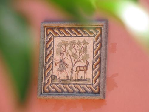 a picture of a woman and a deer in a picture frame at B&B Ai Glicini - Castelli Romani in Marino