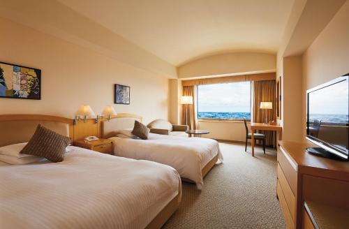 Televisyen dan/atau pusat hiburan di Royal Pines Hotel Urawa