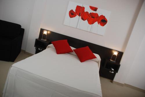 Postel nebo postele na pokoji v ubytování Hotel Polans