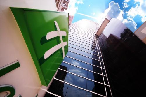 a building with a sign on the side of it at Holiday Inn Bucaramanga Cacique by IHG in Bucaramanga