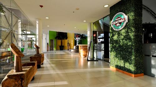 a lobby of a store with a sign on a wall at Holiday Inn Irapuato by IHG in Irapuato
